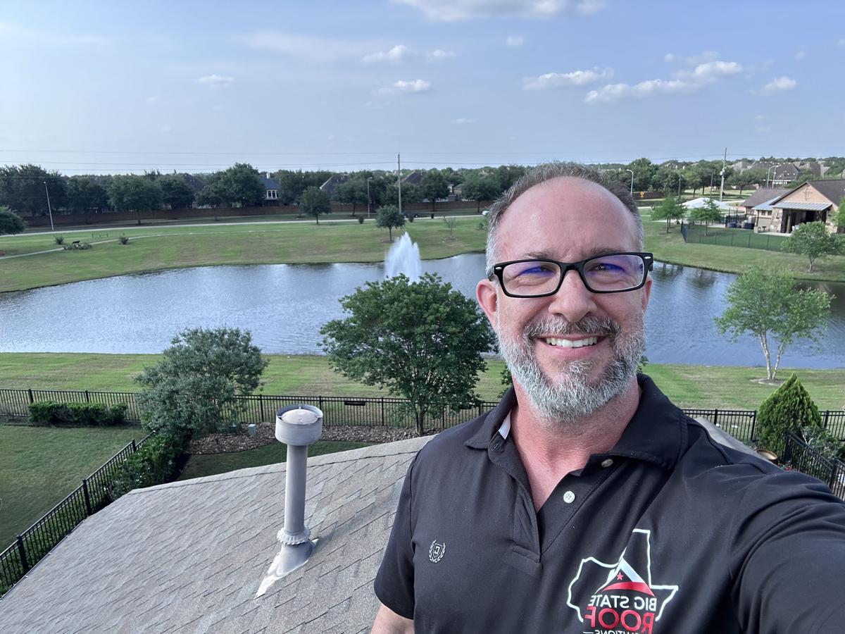 Sonny McClamrock on a roof in Fort Bend County